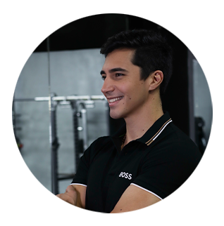 A man wearing a black shirt with the word boss on it