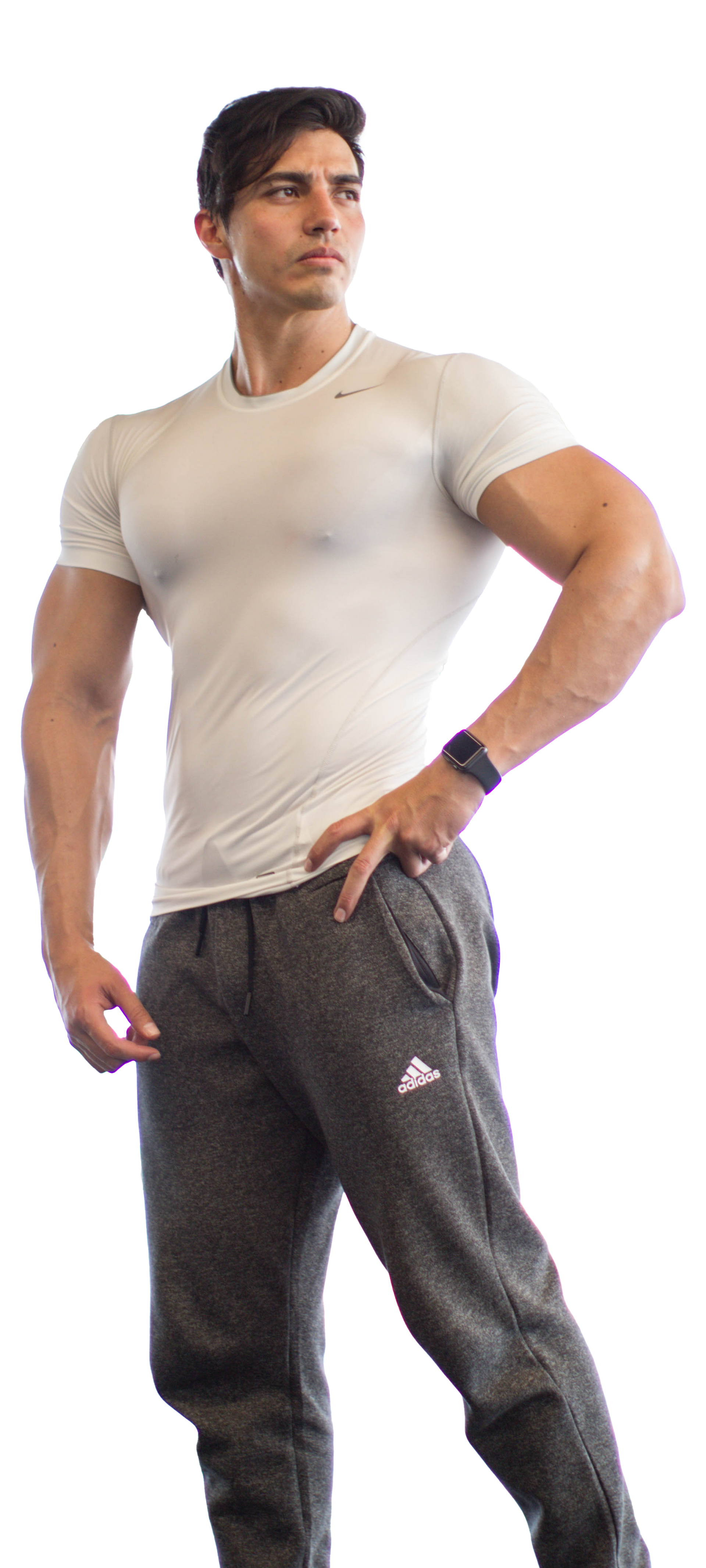 Rodrigo Romeh, Reto Romeh A man in a white t-shirt and grey sweatpants is standing with his hands on his hips.