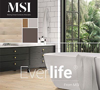 Bathroom with white tub, vanity, and Everlife flooring by MSI; a towel hangs over the tub.