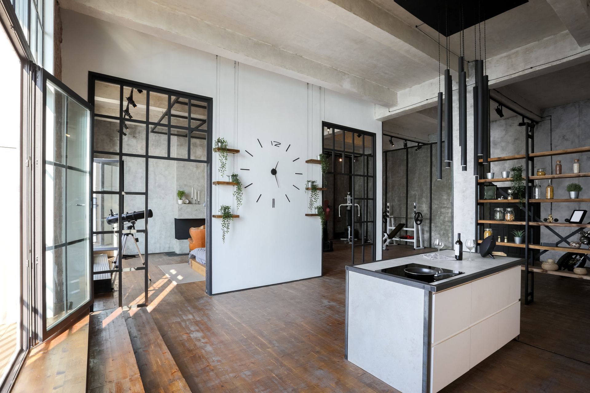 Kitchen with navy blue cabinets, stainless steel appliances, white countertops, and hardwood floors.