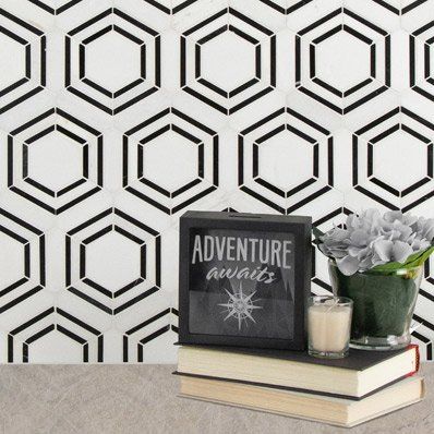 Black and white geometric tiled wall, with a framed