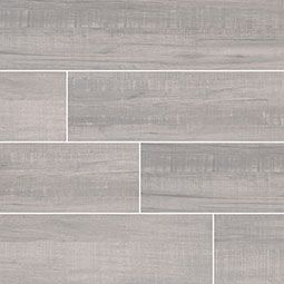 Light gray wood-look tile, with visible grain and varying plank sizes, arranged in a staggered pattern.