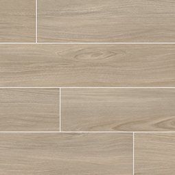 Light brown wood-look tile flooring with visible grain and thin white grout lines.