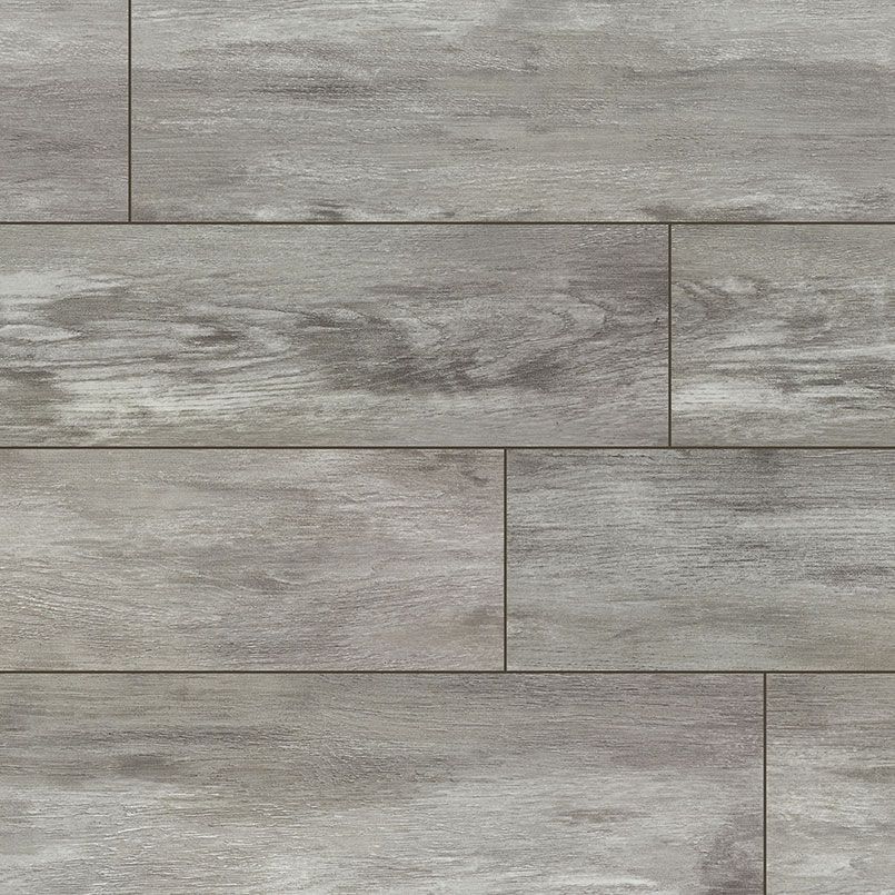 Gray wood-look flooring composed of rectangular planks with darker grain patterns.