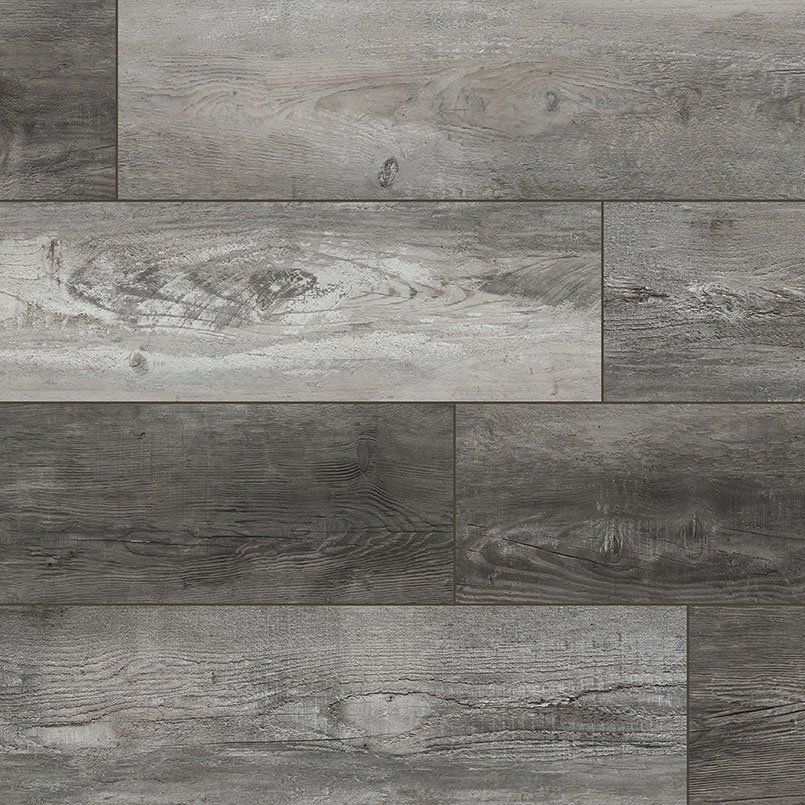 Gray and white wood-look flooring with varying shades and wood grain patterns.