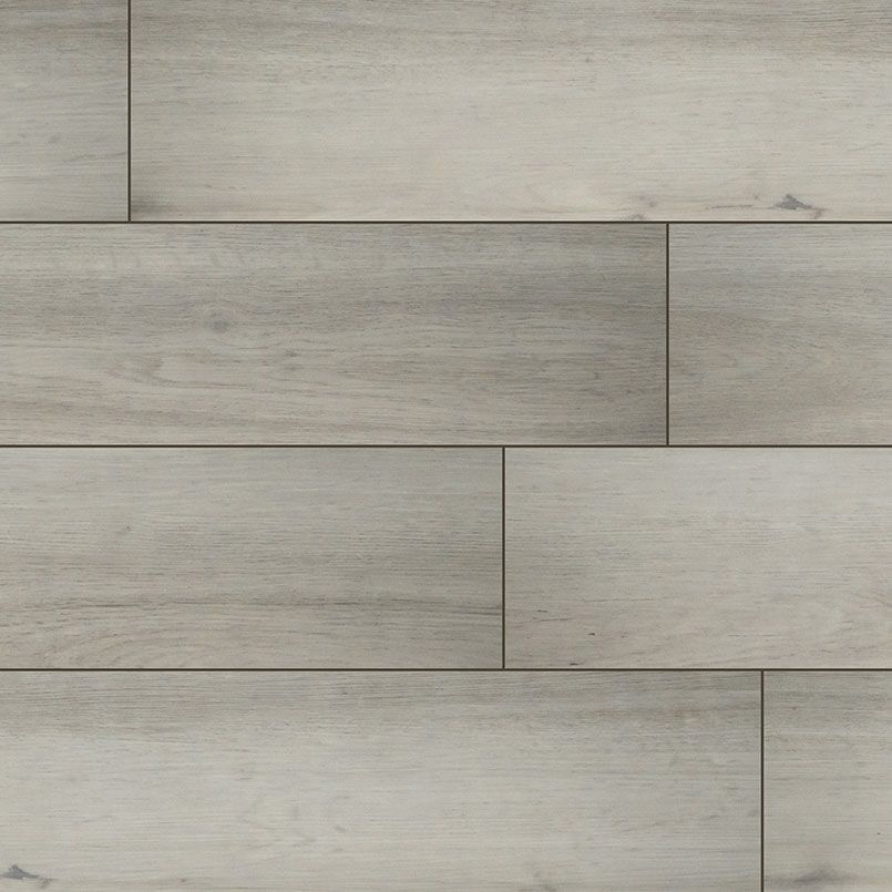 Gray wood-look flooring with planks arranged in a staggered pattern.