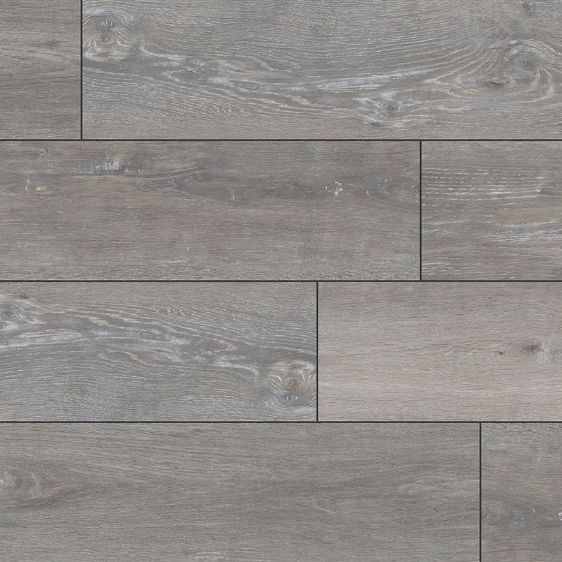 Gray wood flooring with variations in tone and wood grain.