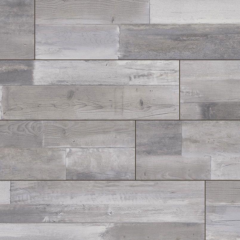 Gray and white weathered wood planks in a staggered pattern.