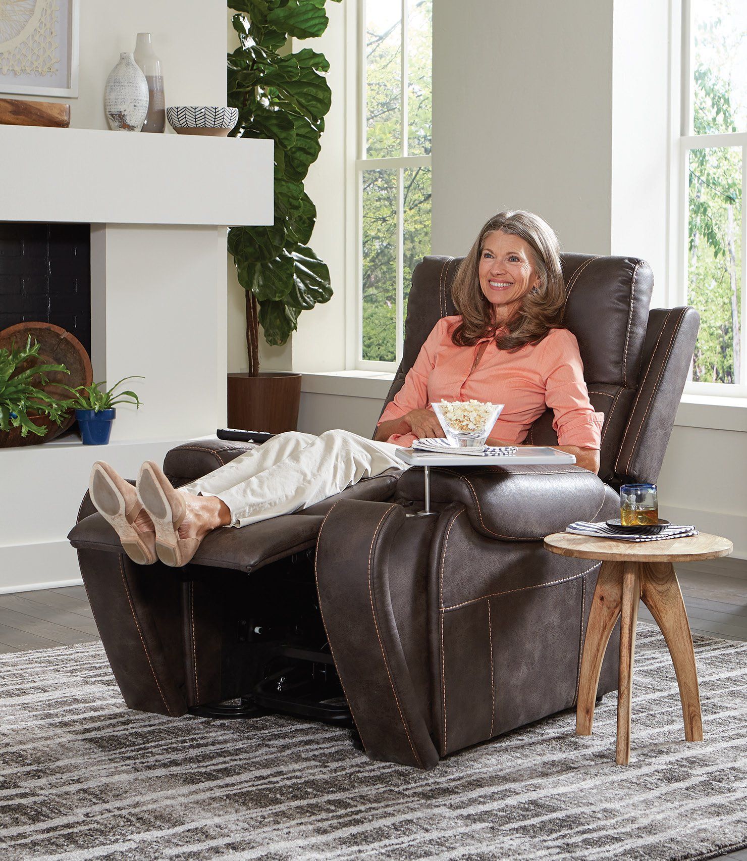 Woman sitting on a four-function Power Lift Chair Recliner