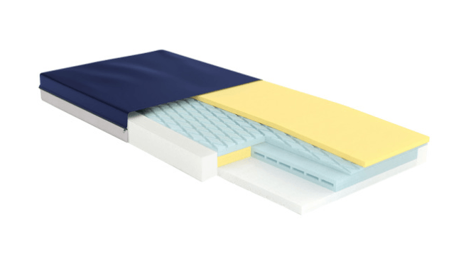 A mattress is cut in half and shows the layers of foam.