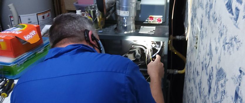 hvac technician repairing hvac