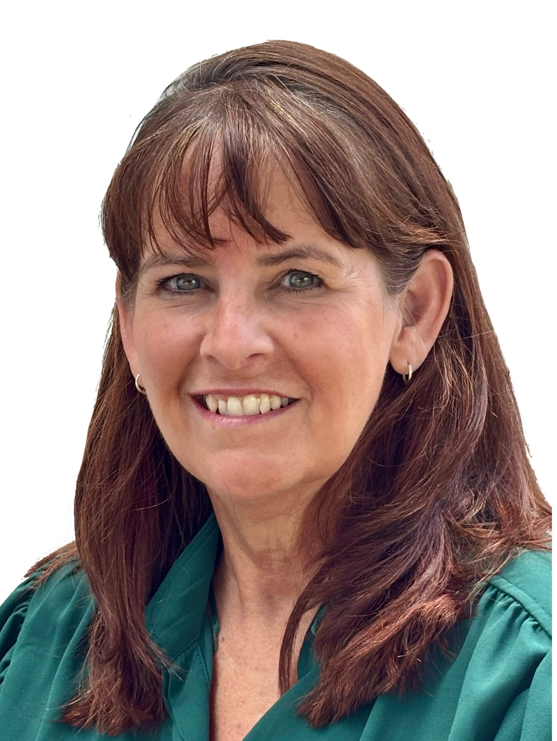 Woman with brown hair in green shirt