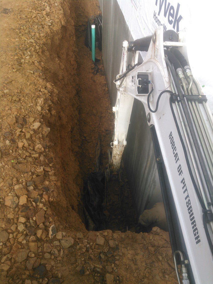 Construction Trucks — Digging Deep For Septic System in Slippery Rock, PA