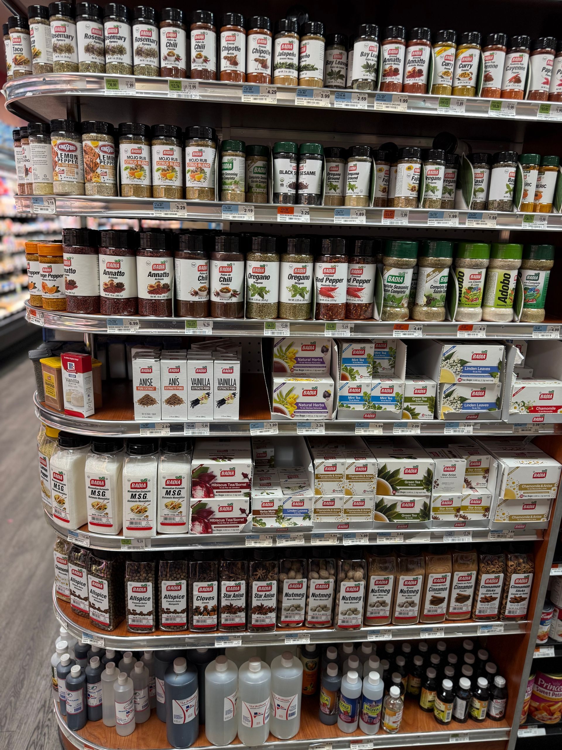A pantry filled with jars , baskets , and bottles.