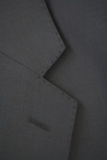 standard lapel with button hole on grey suit