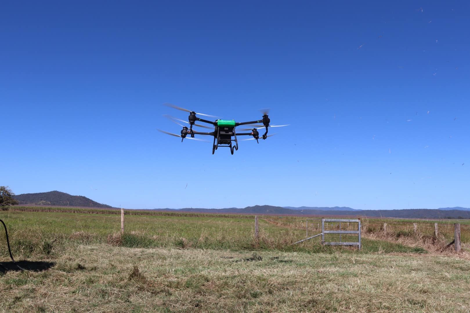 Drone Flying Over a Field Under a Clear Blue Sky — Jetstream Aerial Services in Te Kowai, QLD