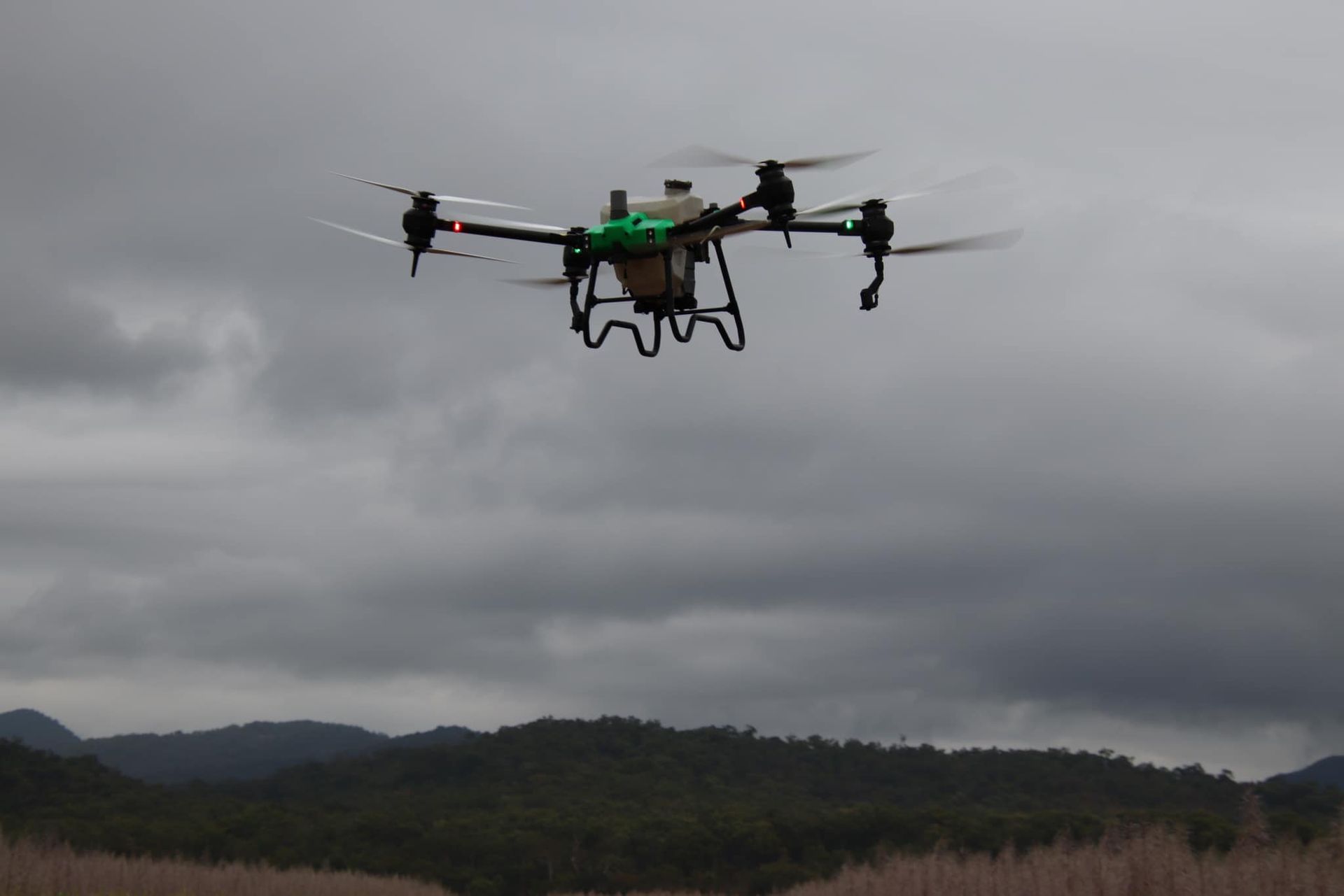Drone in Flight Over a Forest, Under a Cloudy Sky — Jetstream Aerial Services in Te Kowai, QLD