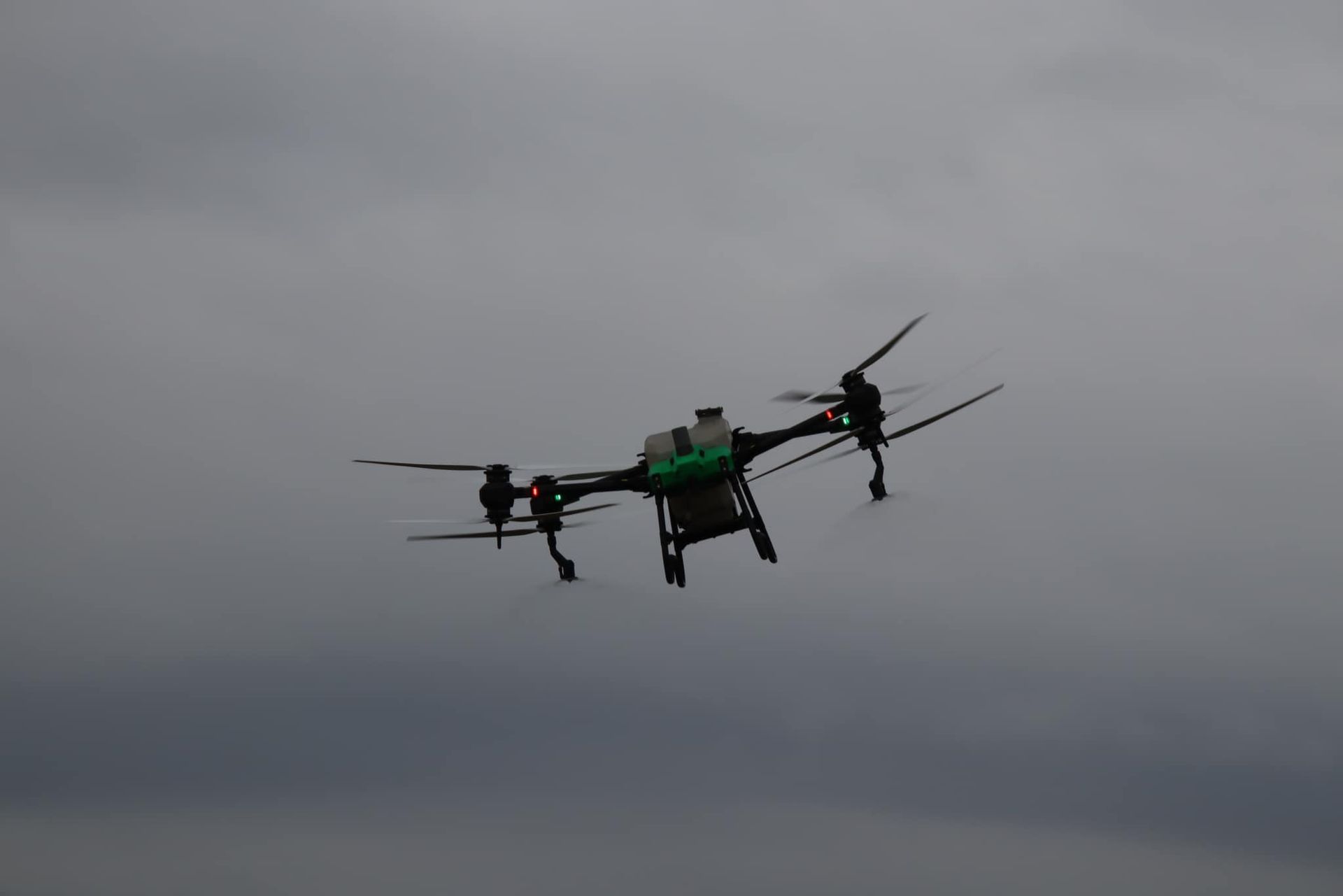 Drone with Multiple Propellers Flying in A Gray, Overcast Sky — Jetstream Aerial Services in Te Kowai, QLD