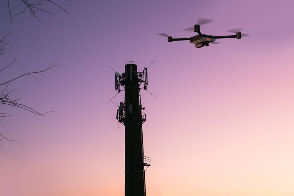 Drone Flying Near a Cell Tower at Sunset — Jetstream Aerial Services in Te Kowai, QLD