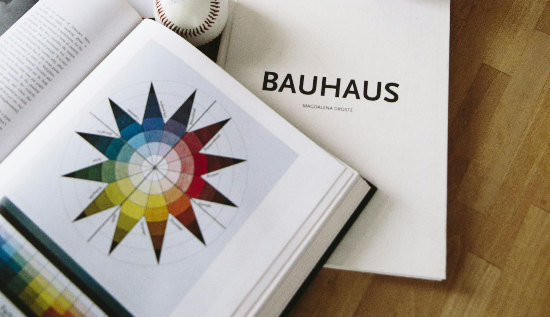 A desk contains books on design and color theory.