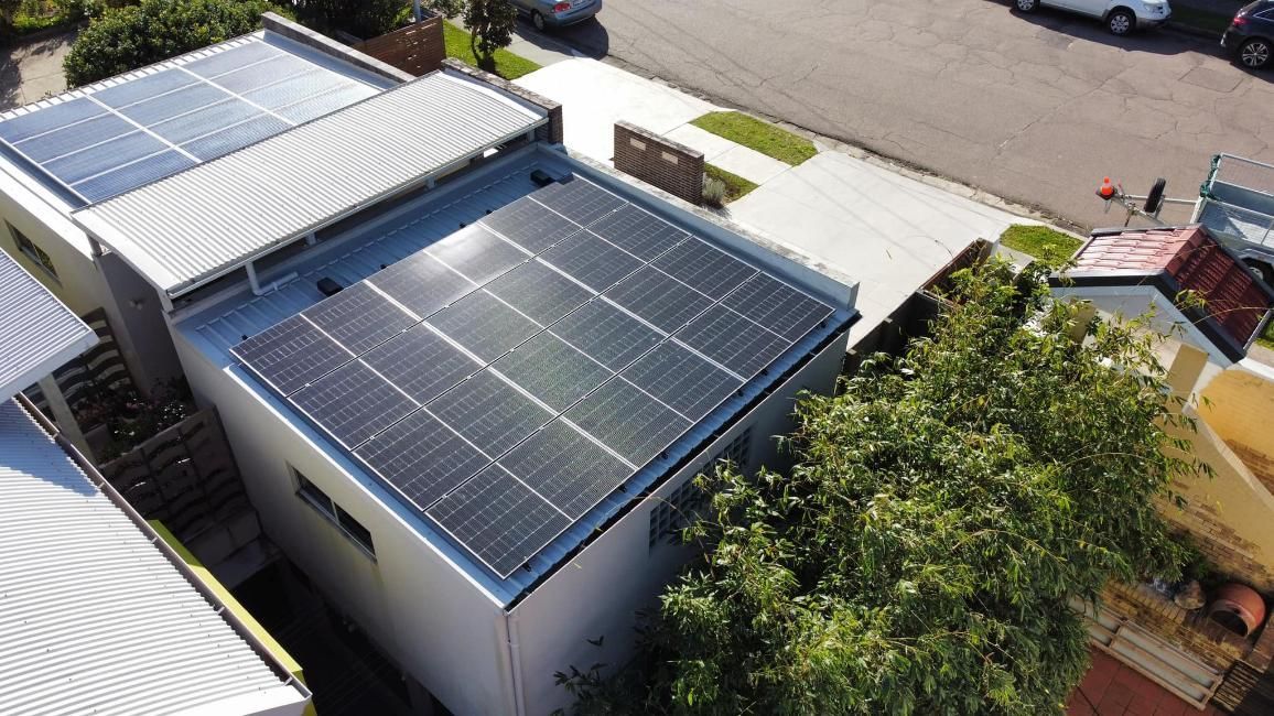 An Aerial View Of A House With Solar Panels On The Roof — PRO Solar & Electrical In Maitland, NSW