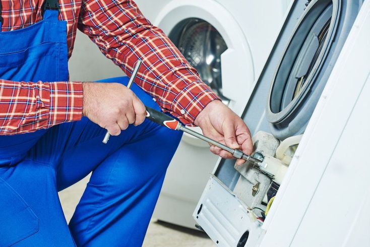 Electrician Repairing Washing Machine — PRO Solar & Electrical In Port Stephens, NSW