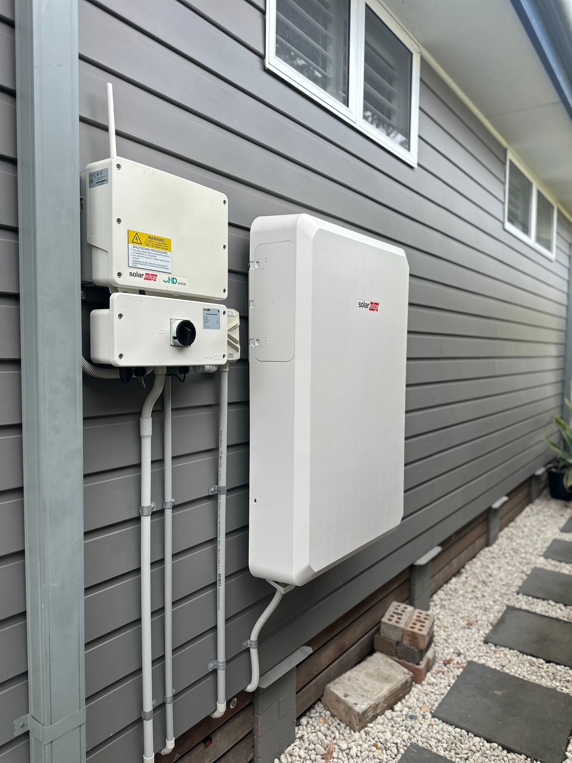Battery place on outside of the house — PRO Solar & Electrical In Newcastle, NSW