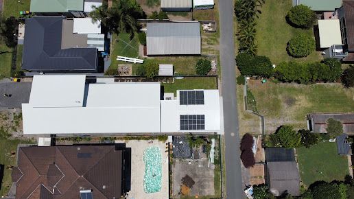 Installed solar panels on roof on a sunny day — Level 2 Electrician in Port Stephens NSW