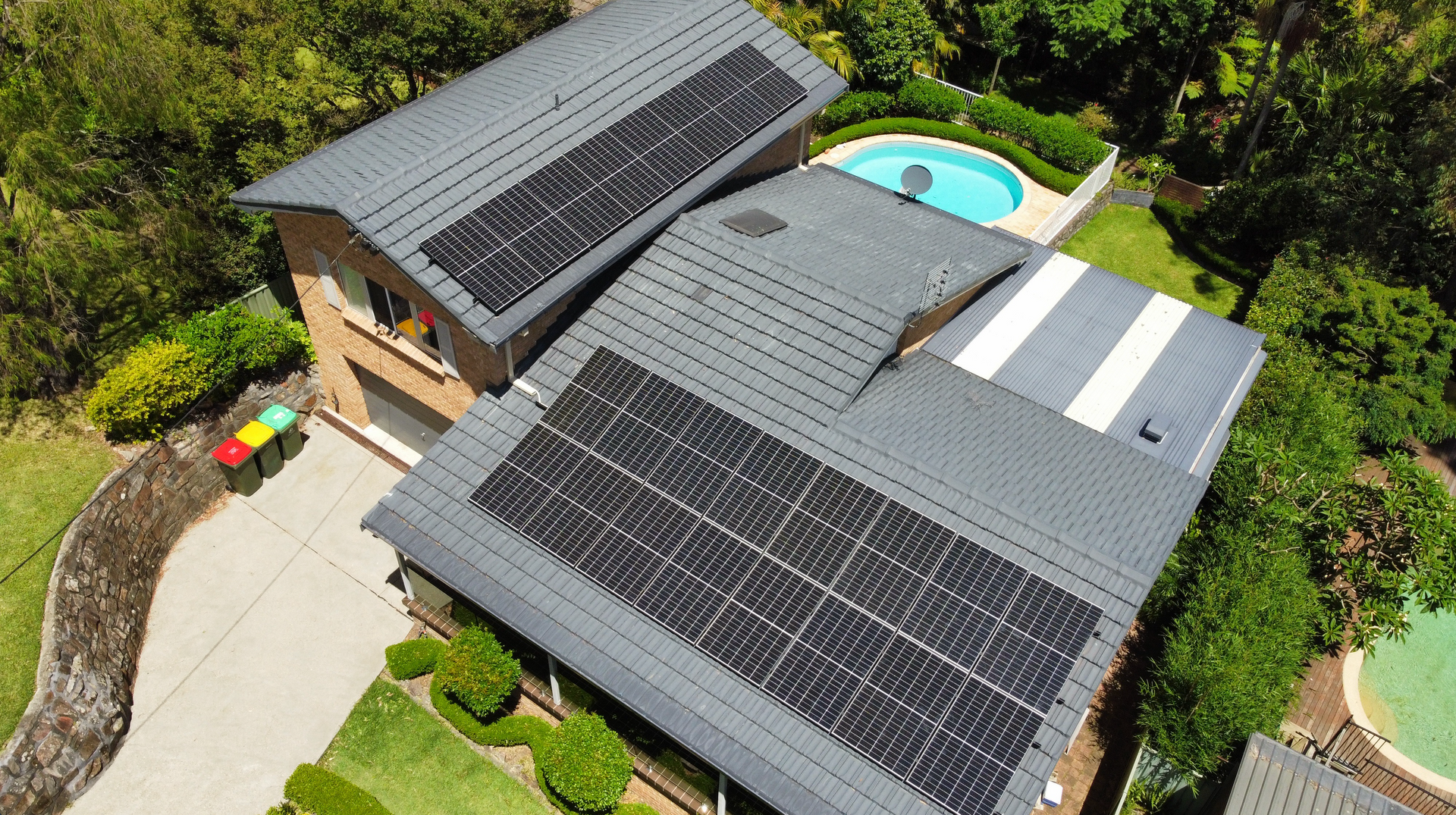 Many Solar Panels Installed At The Foot Of The Mountain — PRO Solar & Electrical In Newcastle, NSW