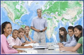 A man stood in front of a map with seven young people sat at a large desk