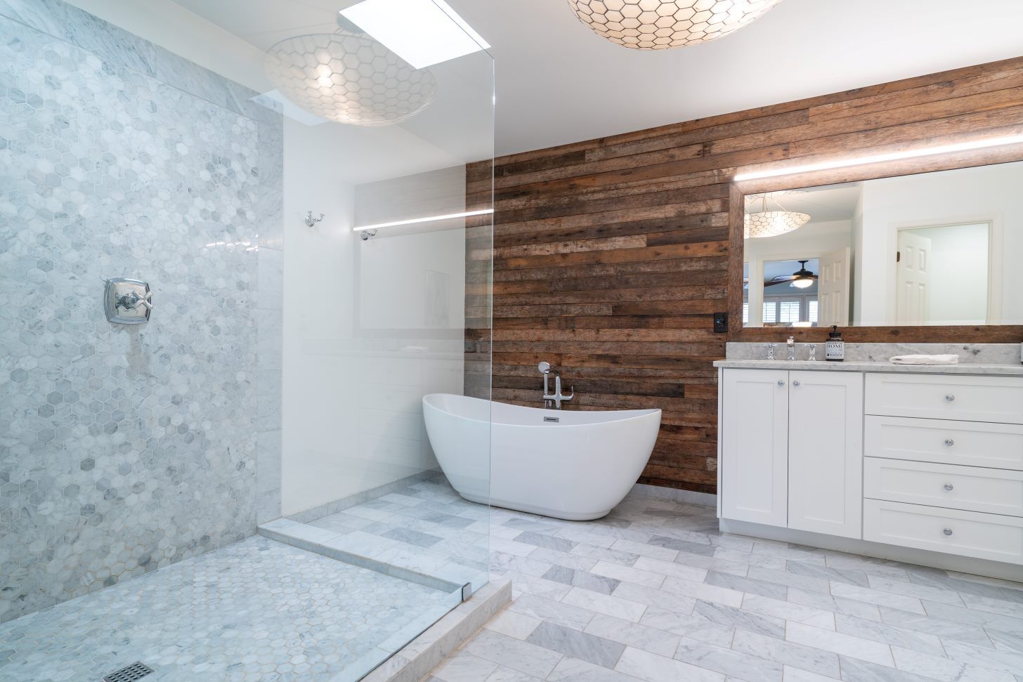 A Bathroom With A Bathtub And A Walk In Shower