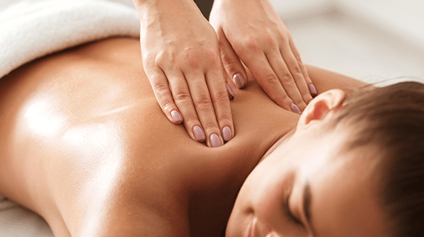 Woman Enjoying Therapeutic Neck Massage in Spa — Milwaukee, WI — Infinity Massage