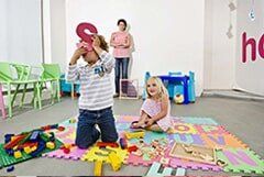 Teacher Watching Students Play - Learning center in Warwick, RI