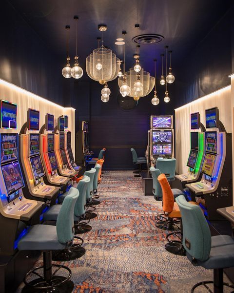 A Room Filled with Lots of Slot Machines and Chairs — Paton's Electrical Services in Hervey Bay, QLD