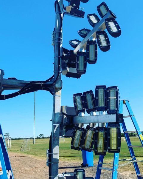 A Bunch of Lights Sitting on Top of A Pole — Paton's Electrical Services in K'Gari, QLD