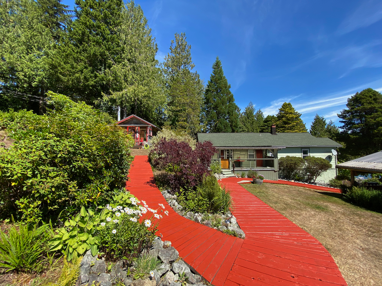 A house with a red walkway leading to it