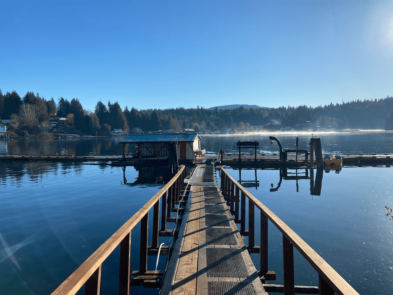 A wooden dock leading to a body of water