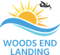 A logo for woods end landing with a sun and waves