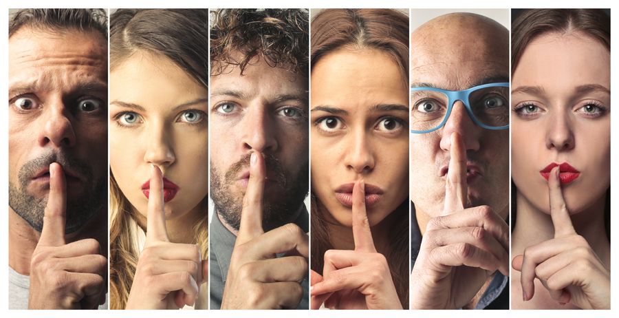 people holding fingers to lips indicating secrets