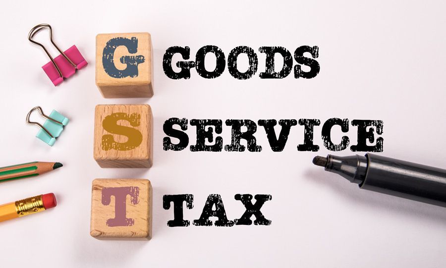 Cubes spelling out GST and text spelling Goods Service Tax
