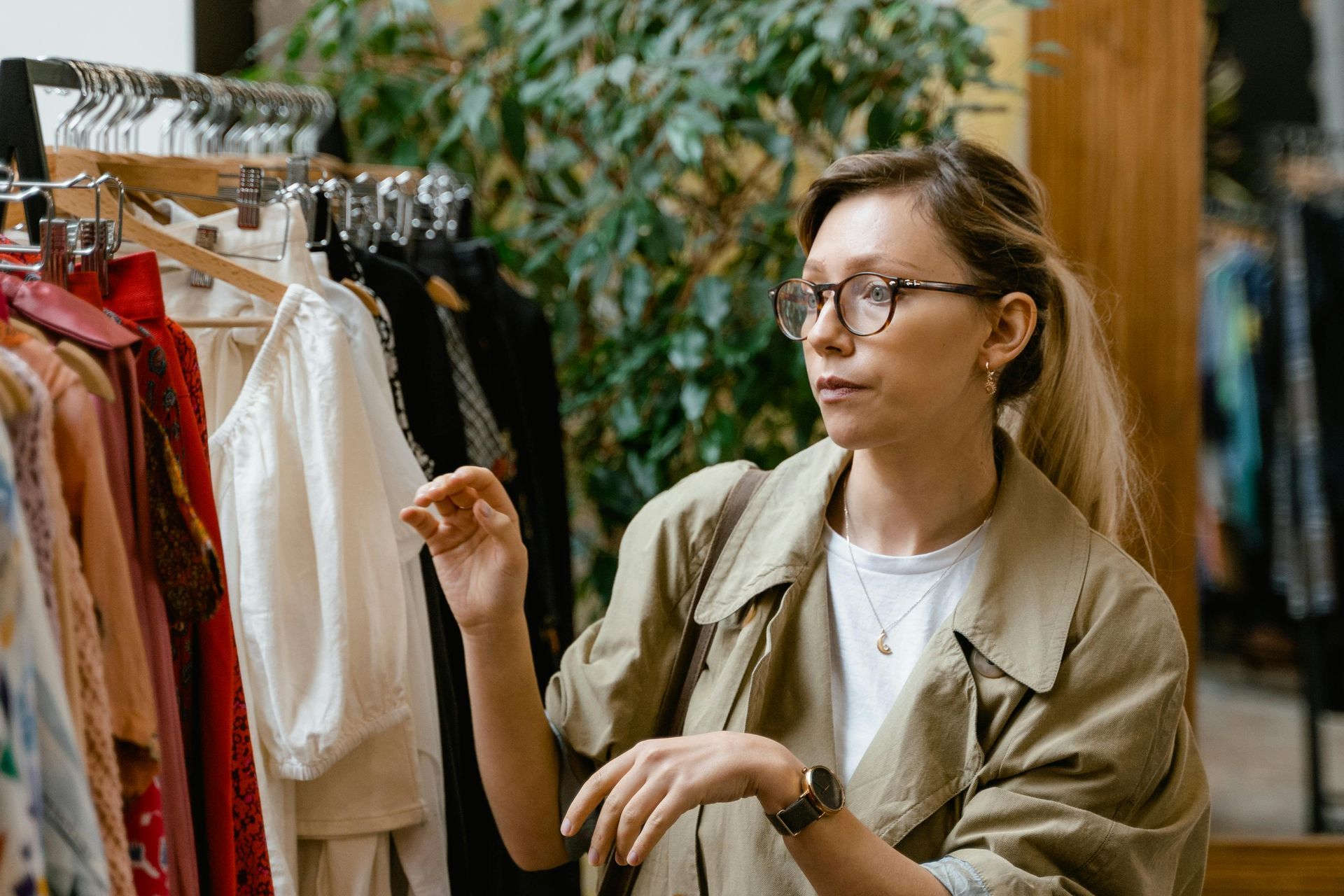 Women browsing clothes at clothing store.