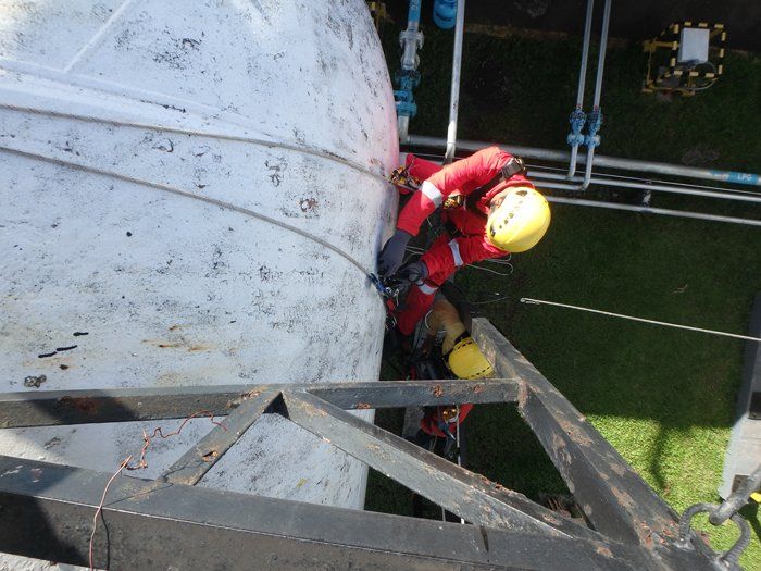 Man Inspecting with Rope