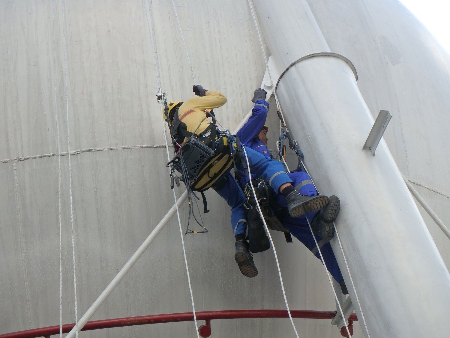 Men Working Spherical Tank