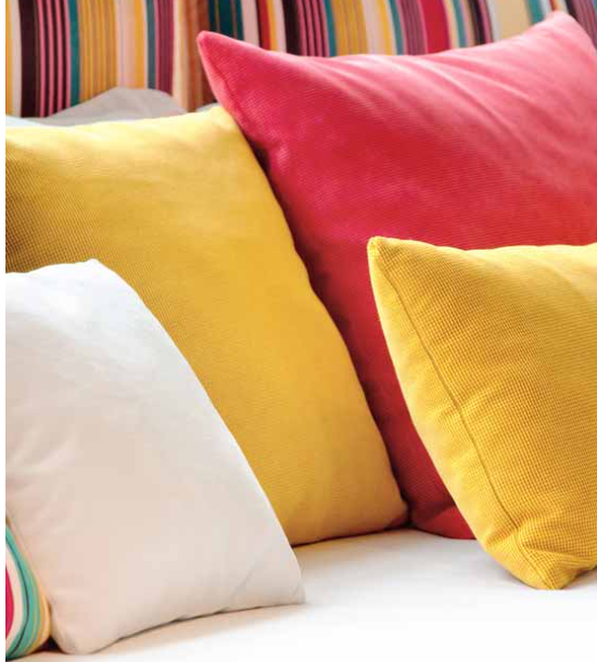 A couch with a bunch of colorful pillows on it