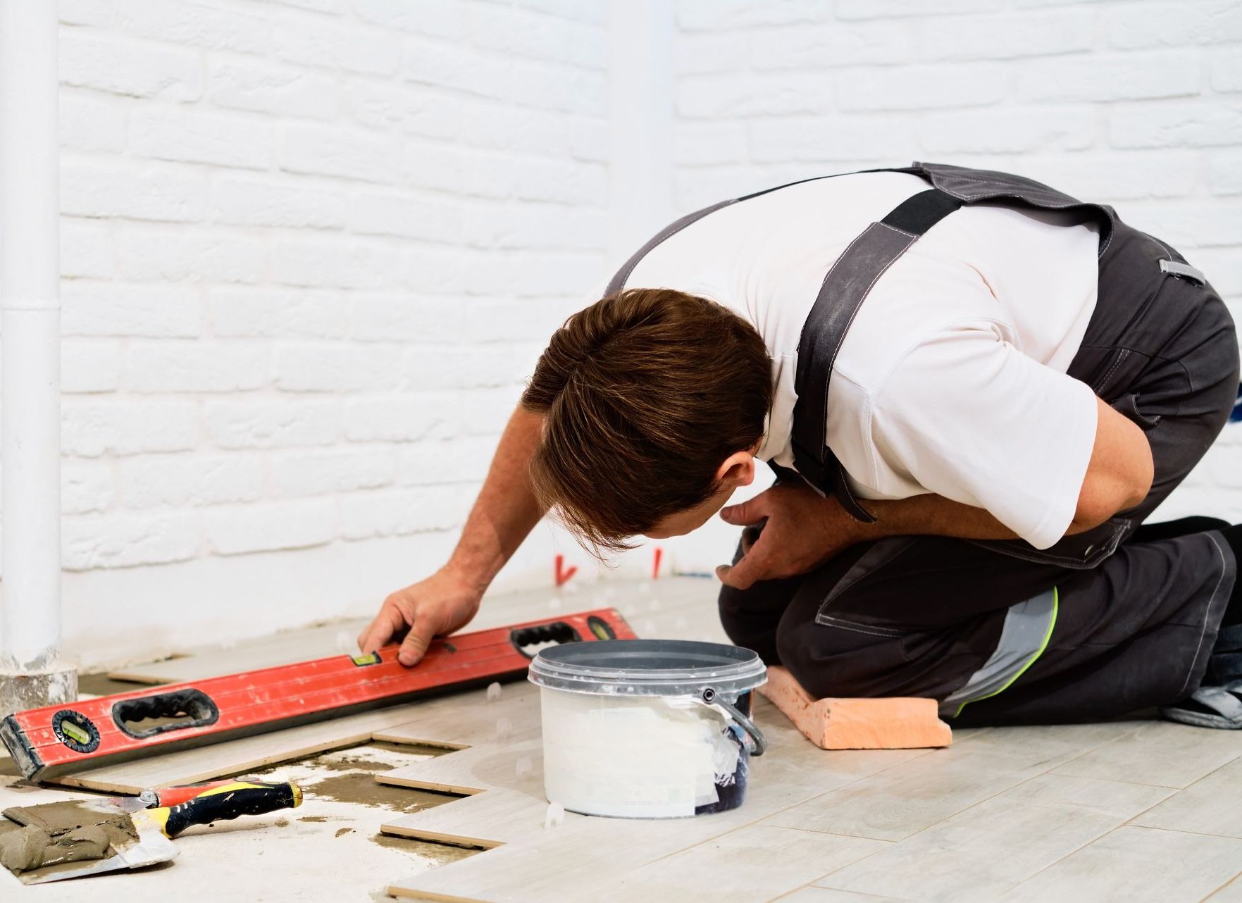 worker checking tile quality