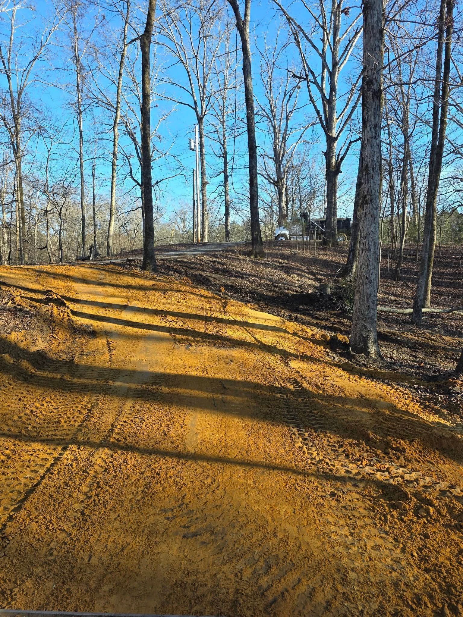 The inside of a moving truck filled with boxes and blankets.