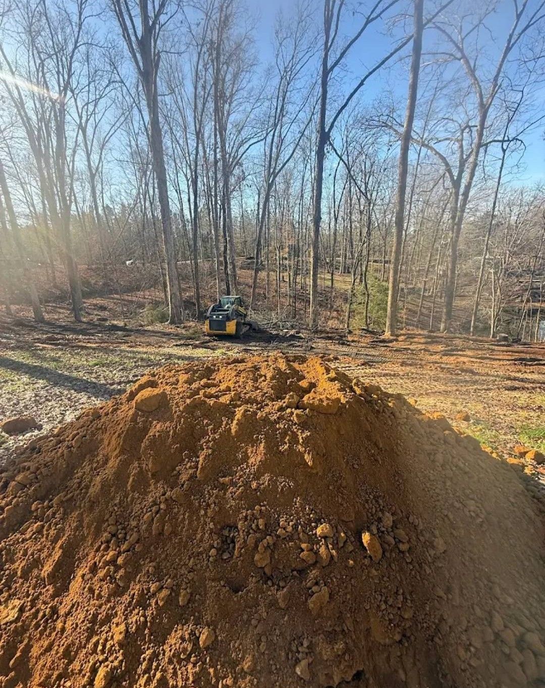 The inside of a moving truck filled with boxes and blankets.