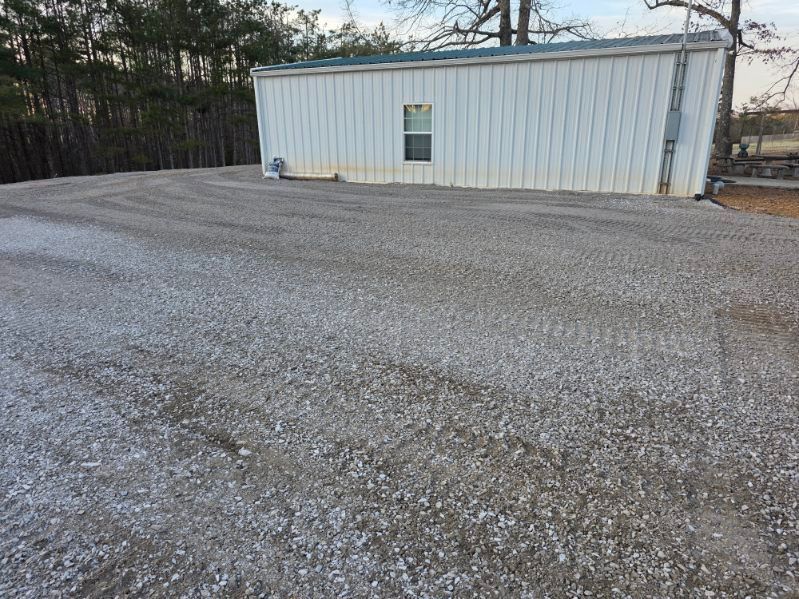The inside of a moving truck filled with boxes and blankets.