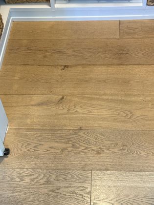A close up of a wooden floor in a room