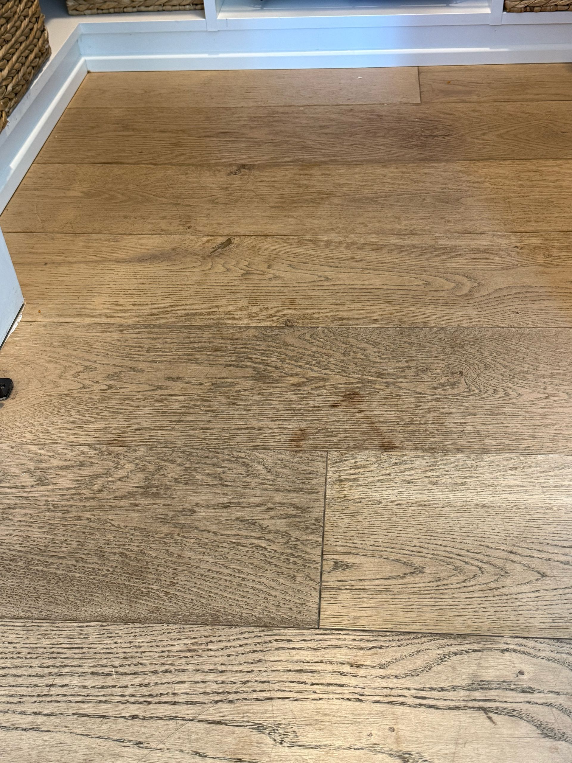 A close up of a wooden floor in a room